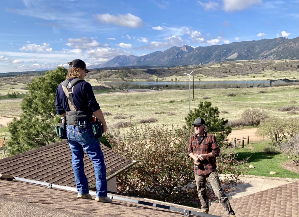 Two Solar Installers Working